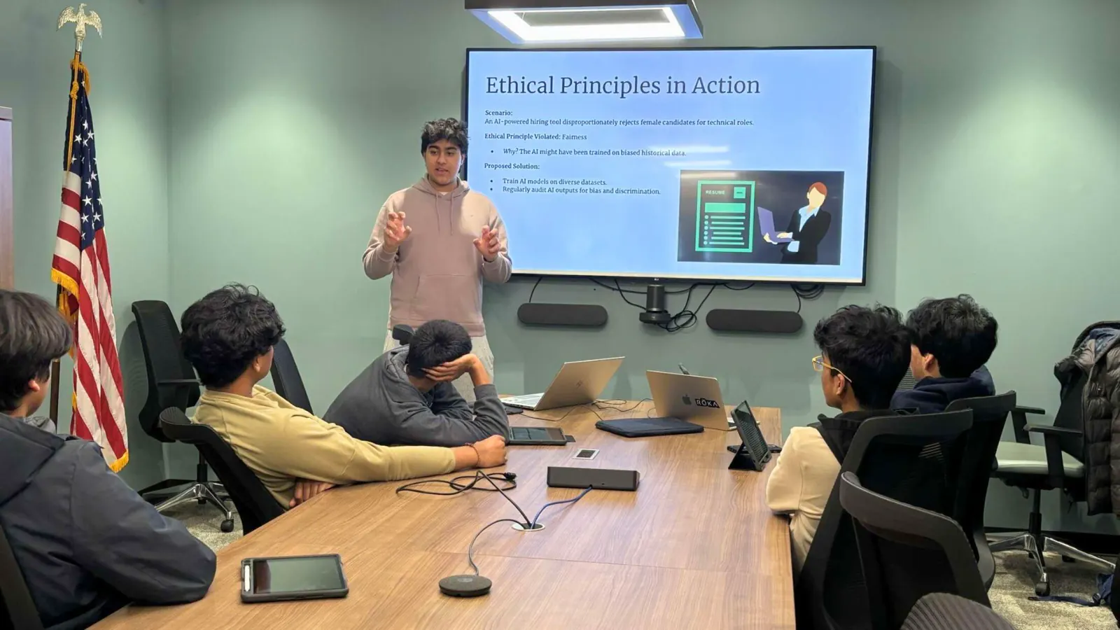 Students at the Ela Area Public Library listen to a presentation on ethical principles in AI.